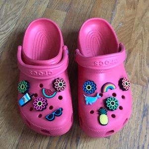 Brand new Women’s size 8 Crocs. Never worn. Pinkish color with accessories.